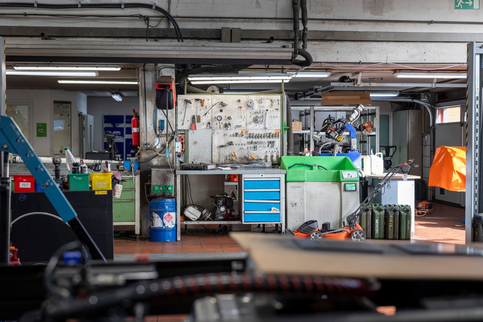 View into the workshop with workbenches and a tool wall