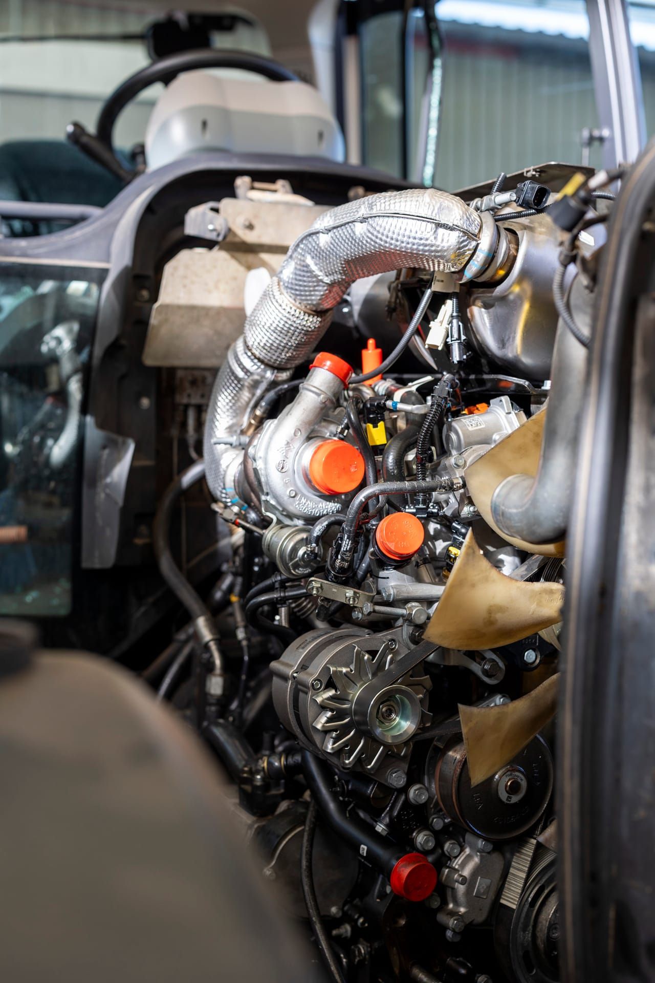 Open engine bay of a machine in the workshop