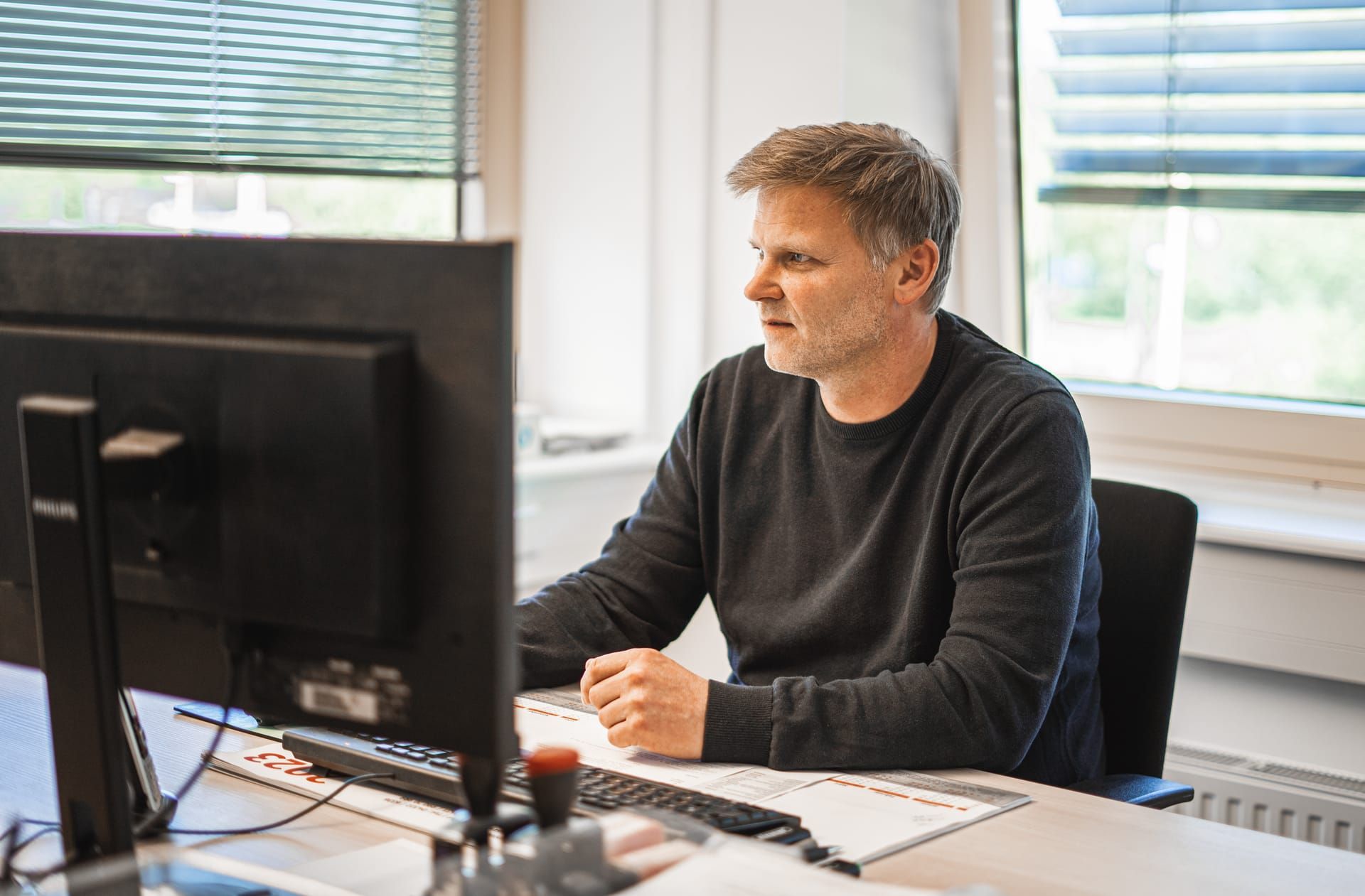 Mitarbeiter der Betriebsleitung am Arbeitsplatz